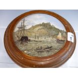 A 19TH CENTURY PRATTWARE PICTORIAL POT LID "NAPARIMA TRINIDAD" MOUNTED IN AN OAK FRAME.