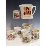 A VINTAGE WADE, BELL WHISKY JUG WITH "AFORE YE GO" LOGO TOGETHER WITH FIVE COMEMMORATIVE MUGS, A
