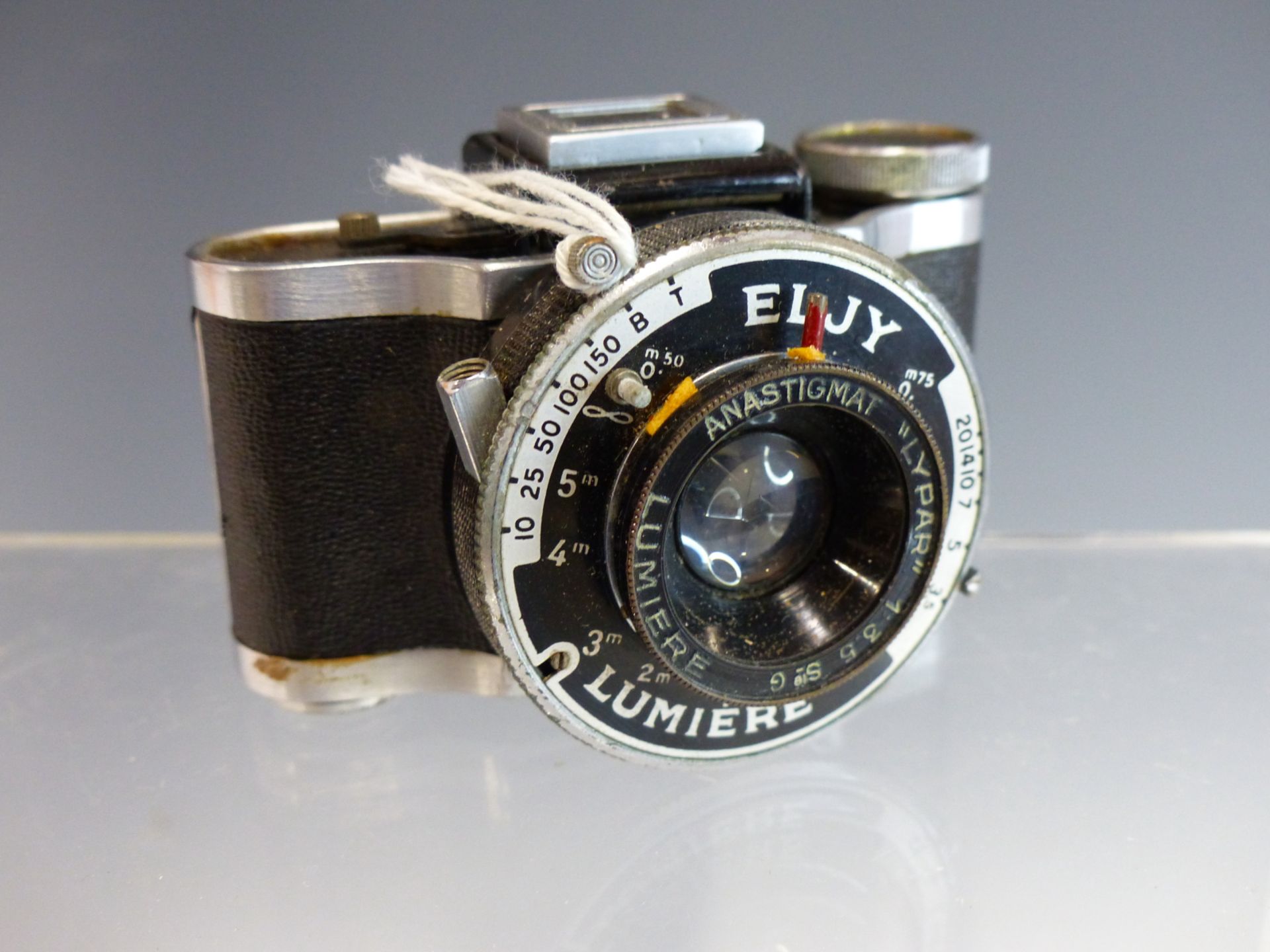 A VINTAGE ELJY LUMIERE MINIATURE ROLL FILM CAMERA WITH "LYPAR" LENS.