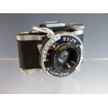 A VINTAGE ELJY LUMIERE MINIATURE ROLL FILM CAMERA WITH "LYPAR" LENS.