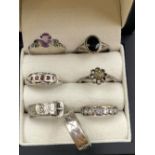 A COLLECTION OF SEVEN SILVER RINGS, TO INCLUDE A FULL ETERNITY BAND WITH 9CT GOLD BORDER. TWO SILVER