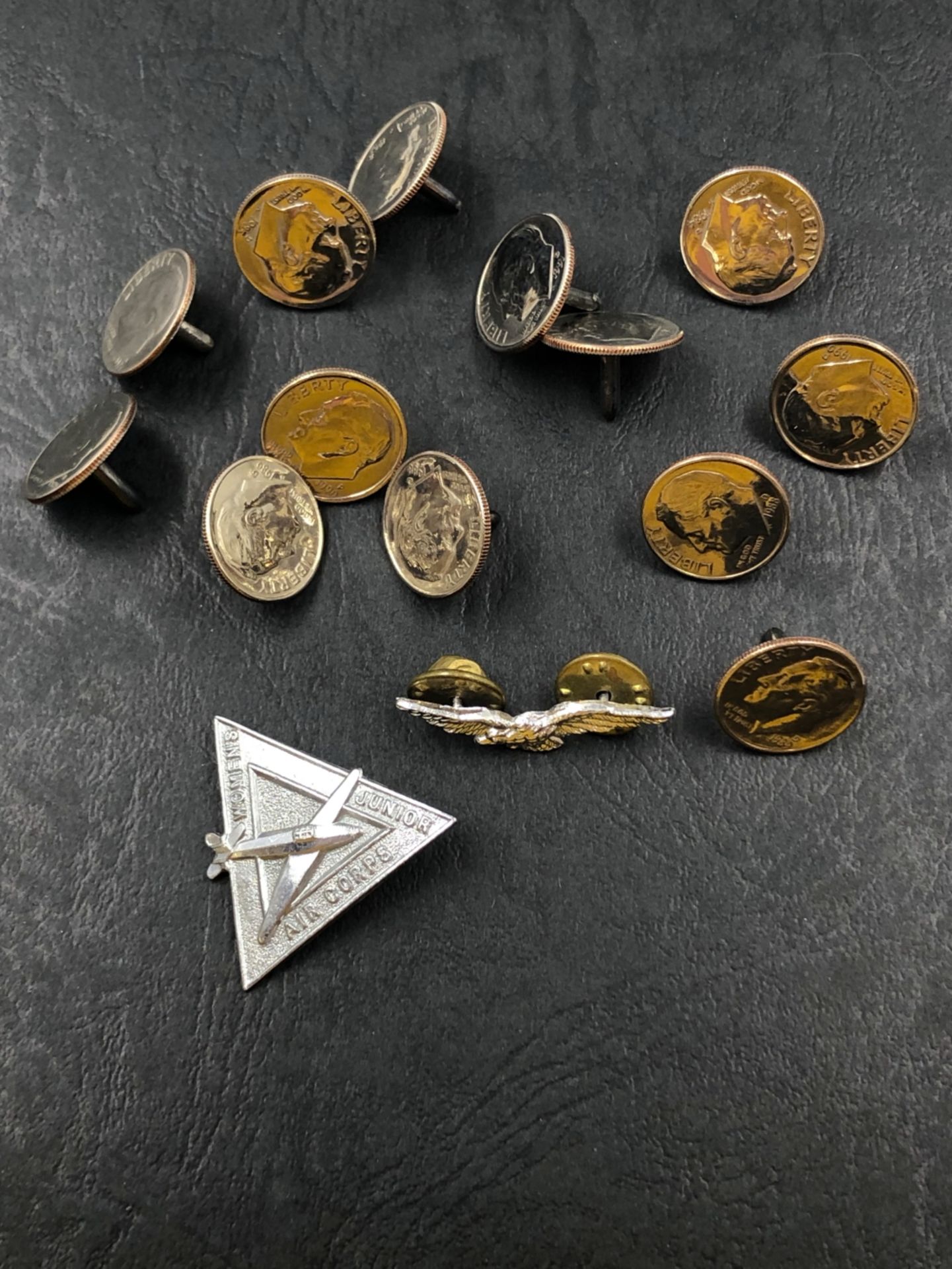 AN UNUSUAL COLLECTION OF 13 ONE DIME AMERICAN COINS WITH ATTACHED POSTS, TOGETHER WITH A WOMEN'S AIR