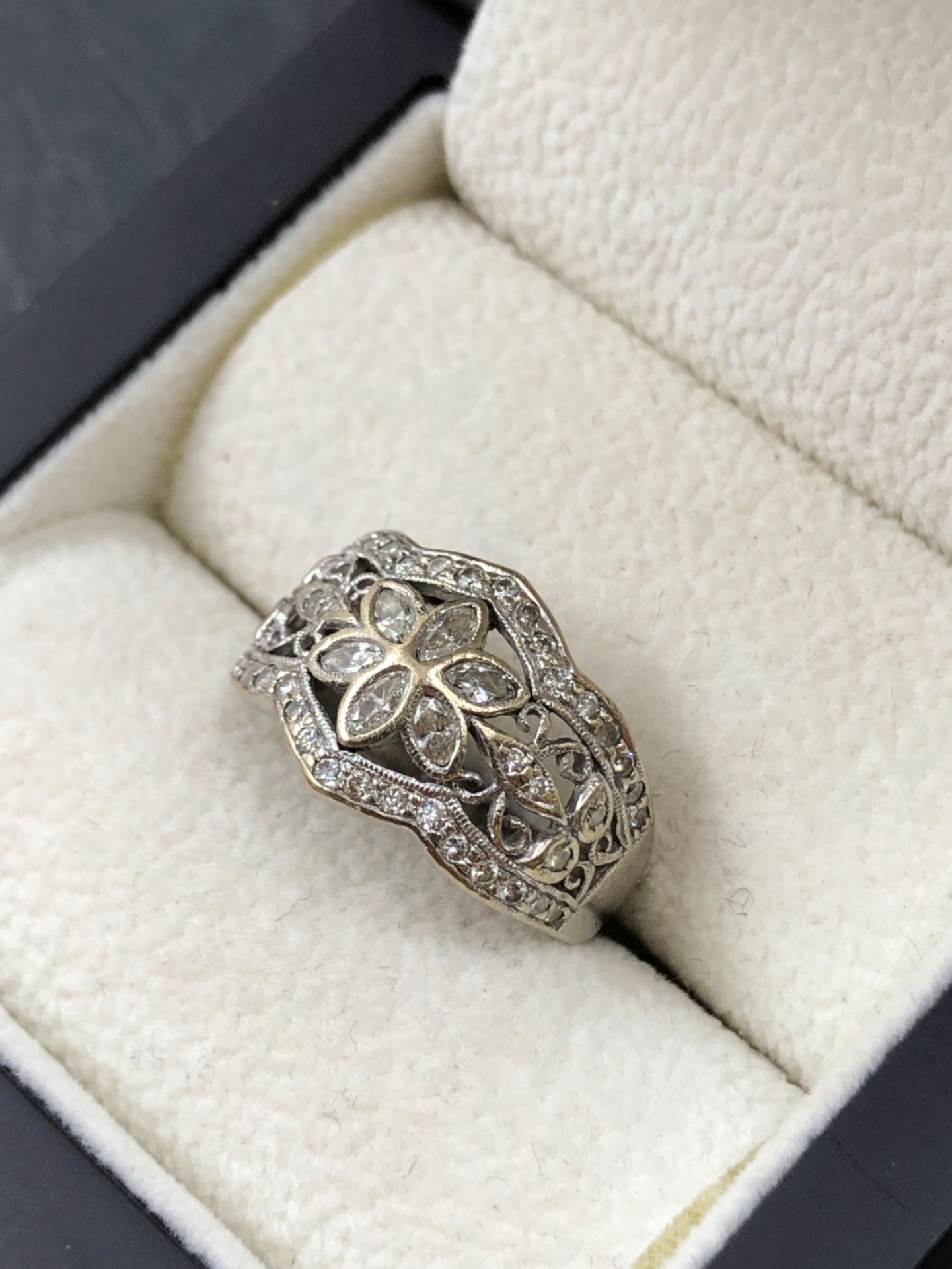 A DIAMOND SET FOLIATE STYLE PANEL RING. THE RING WITH A CENTRAL MARQUISE CUT SIX LEAF CLUSTER WITH - Image 2 of 3