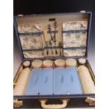 A VINTAGE BREXTON 1950'S FITTED PICNIC SET WITH WHITE BAKELITE FOLDING HANDLES.