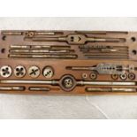 AN IMPRESSIVE LARGE WOODEN CASED STEEL TAP AND DIE SET.