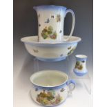 AN EARLY 20th CENTURY POTTERY WASH JUG AND BOWL SET WITH COTTAGE AND FLORAL DECORATION, AND TWO