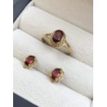 A HALLMARKED 9ct GOLD GARNET DRESS RING, FINGER SIZE N, TOGETHER WITH A PAIROF SIMILAR EARRINGS,