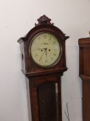 A MAHOGANY CASED EIGHT DAY LONG CASE CLOCK WITH ROUND DIAL.