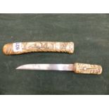 A SMALL JAPANESE KNIFE IN CARVED BONE SCABBARD