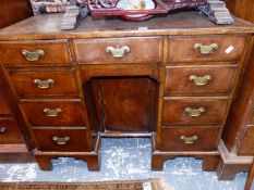 A 18th C. AND LATER WALNUT KNEE HOLE DESK