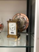 A CARRIAGE TIMEPIECE TOGETHER WITH A SMITHS MANTEL CLOCK WITH A CHROME AND PINK GLASS CHAPTER RING