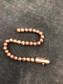 A ANTIQUE BEADED BRACELET, NO ASSAY MARKS, ASSESSED AS 18ct GOLD. WEIGHT 9.08grms.