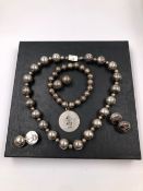 MEXICAN SILVER TO INCLUDE A BEAD NECKLACE, AND A PAIR OF STUD EARRINGS. A FURTHER SILVER EXPANDING
