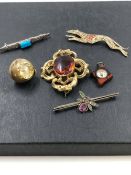 A LARGE ANTIQUE BROOCH, STAMPED PATENT ON THE PIN HINGE, TOGETHER WITH AN AMIDA ROUND PENDANT WATCH,