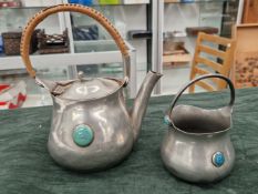 ARTS AND CRAFTS PEWTER TEAPOT AND SUGAR BOWL, BY CONNELL OF CHEAPSIDE, C.1905. POSSIBLY A DESIGN
