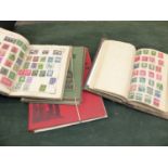 FOUR OLD STAMP ALBUMS AND CONTENTS.