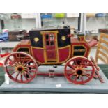 AN EARLY 20th CENTURY SCRATCH BUILT MODEL OF A VICTORIAN MAIL COACH MOUNTED ON A LATER BASE. THE