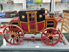 AN EARLY 20th CENTURY SCRATCH BUILT MODEL OF A VICTORIAN MAIL COACH MOUNTED ON A LATER BASE. THE