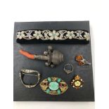 AN ANTIQUE HALLMARKED SILVER AND CORAL PART BABIES RATTLE TOGETHER WITH A PASTE BUCKLE BROOCH, A
