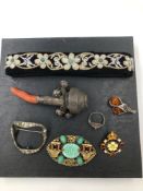 AN ANTIQUE HALLMARKED SILVER AND CORAL PART BABIES RATTLE TOGETHER WITH A PASTE BUCKLE BROOCH, A