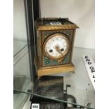 A JAPY STRIKING MANTEL CLOCK IN A SIMULATED CLOISONNE CASE