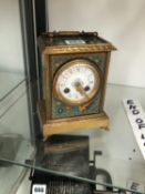 A JAPY STRIKING MANTEL CLOCK IN A SIMULATED CLOISONNE CASE