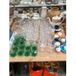 CLEAR GLASS WINE GLASSES, GREEN TUMBLERS TOGETHER WITH VILLEROY AND BOCH COFFEE CUPS, ETC.