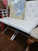 A SET OF FOUR CHROME AND WHITE LEATHER DINING CHAIRS