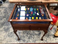 A GLAZED MAHOGANY TWO DRAWER DISPLAY TABLE