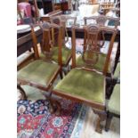 A SET OF FOUR EDWARDIAN LYRE BACK DINING CHAIRS