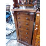 A SMALL VICTORIAN MAHOGANY WELLINGTON CHEST WITH CARVED COLUMNS