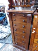 A SMALL VICTORIAN MAHOGANY WELLINGTON CHEST WITH CARVED COLUMNS