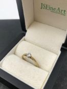 A 9ct HALLMARKED GOLD DIAMOND SOLITAIRE RING IN A EIGHT CLAW SETTING. DIAMOND SIZE 4.0 X 2.4mm.