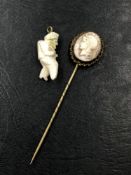 A EARLY 20th CENTURY CARVED PORTRAIT CAMEO OF A TROJAN BUST MOUNTED AS A STICK PIN AND AN ANTIQUE