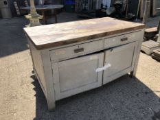 A PAINTED RUSTIC CABINET WITH WORK BENCH TOP.