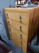 AN ART DECO STYLE GOLDEN OAK CHEST OF FIVE DRAWERS