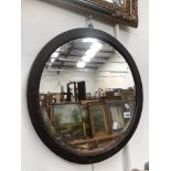 A WOODEN FRAMED ROUND MIRROR 50 cm