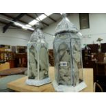 A PAIR OF EASTERN PAINTED METAL CANDLE LANTERNS.