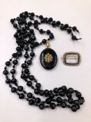 AN OVAL MOURNING PENDANT WITH SEED PEARL MONOGRAM, A ROW OF BLACK FACET BEADS, AND A GLAZED SEED