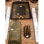 AN ARTS AND CRAFTS BRASS WALL SUSPENDING CANDLESTICK, A TOLE TRAY TOGETHER WITH A LETTER RACK