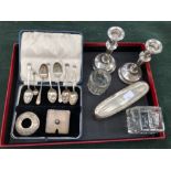 A SET OF HALLMARKED SILVER TEASPOONS, A PAIR OF LOADED SILVER CANDLESTICKS, TWO SILVER LIDDED