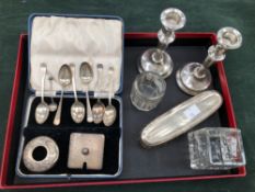 A SET OF HALLMARKED SILVER TEASPOONS, A PAIR OF LOADED SILVER CANDLESTICKS, TWO SILVER LIDDED