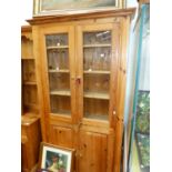 A VINTAGE PINE FOUR DOOR KITCHEN CABINET