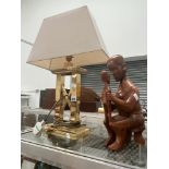 A BRASS TABLE LAMP TOGETHER WITH AN AFRICAN CARVED WOOD MOTHER AND CHILD