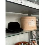 A BOXED BOWL HAT TOGETHER WITH A TRILBY