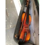 A VIOLIN AND BOW IN A LEATHERETTE CASE