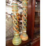TWO BARLEY TWIST LARGE WOODEN CANDLESTICKS.