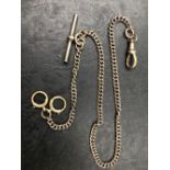 A VINTAGE DOUBLE ALBERT WATCH CHAIN COMPLETE WITH T-BAR, CLASPS POSSIBLY CONTINENEL LOW GRADE. THE