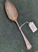 A VICTORIAN SILVER BRIGHT CUT AND SCALLOPED EDGE BERRY OR FRUIT SERVING SPOON WITH GILT BOWL.