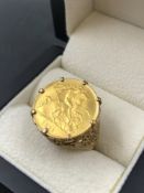A 1911 22ct GOLD HALF SOVEREIGN IN A 9ct GOLD HALLMARKED RING MOUNT. FINGER SIZE O 1/2. GROSS WEIGHT